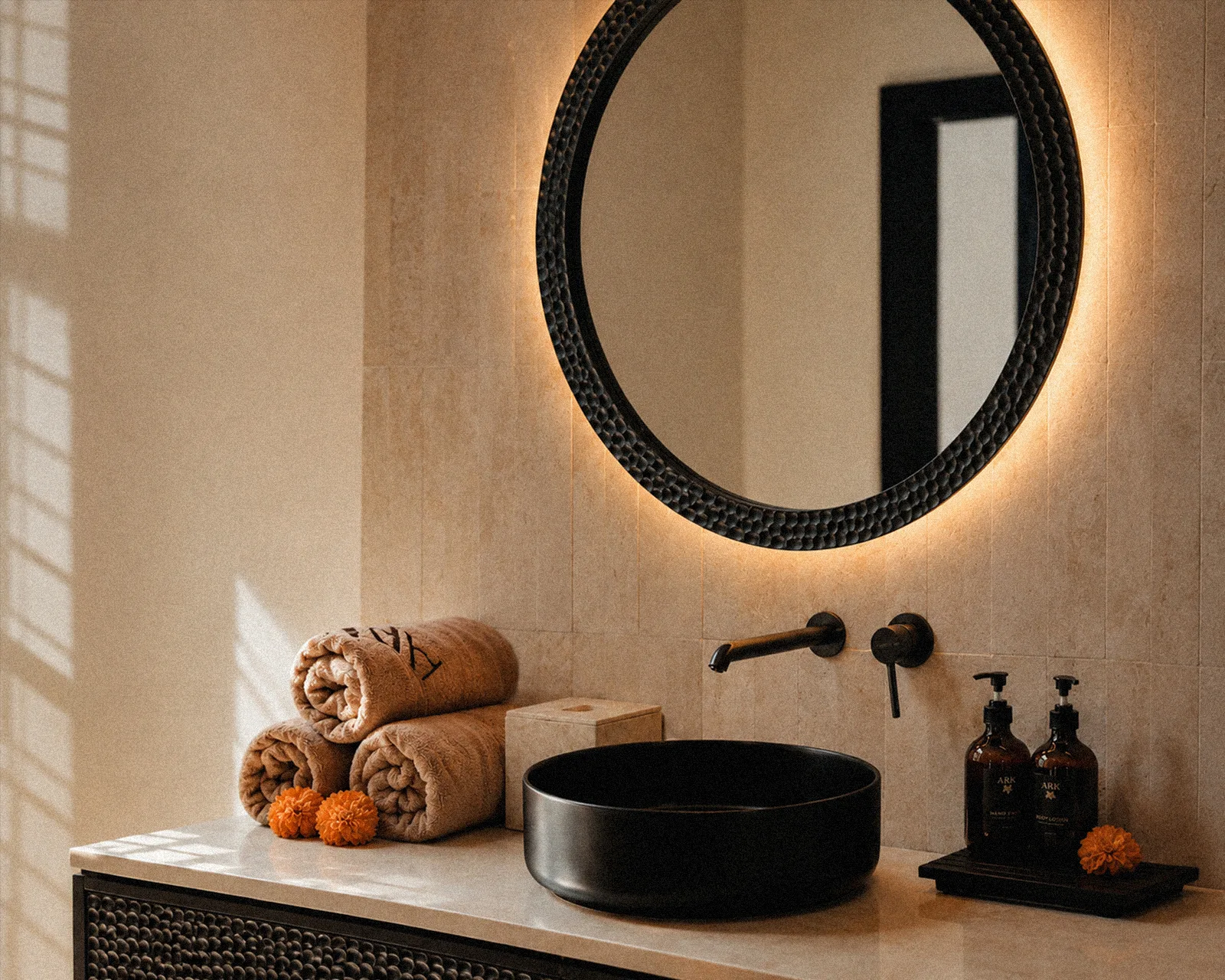 Round carved bathroom mirror at The Ark
